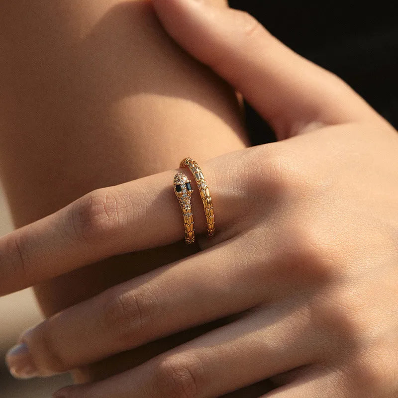 Snake-shaped adjustable copper ring with gold colour plating and diamond treatment