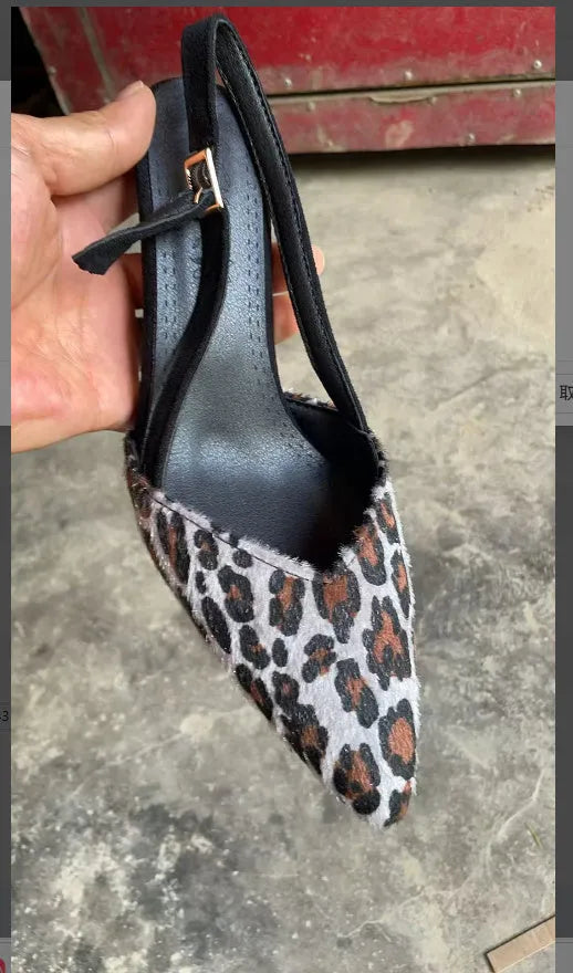 Women's leopard print suede sandals with a pointed toe and high heel.