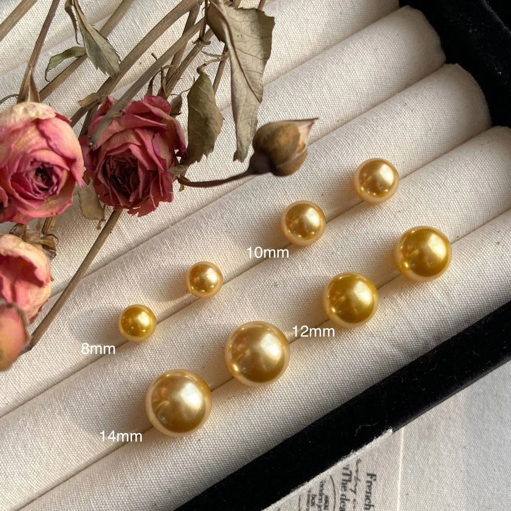 Geometric pearl stud earrings with Awn star motifs in silver, showing size options