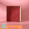 A5 square notebook with faux leather cover showing colour options and open blank pages