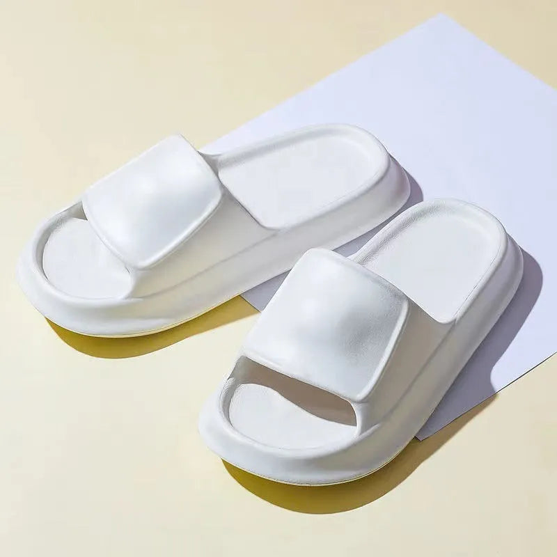 Thick-soled EVA flip-flop slippers in multiple colours on a white background.