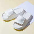 Thick-soled EVA flip-flop slippers in multiple colours on a white background.