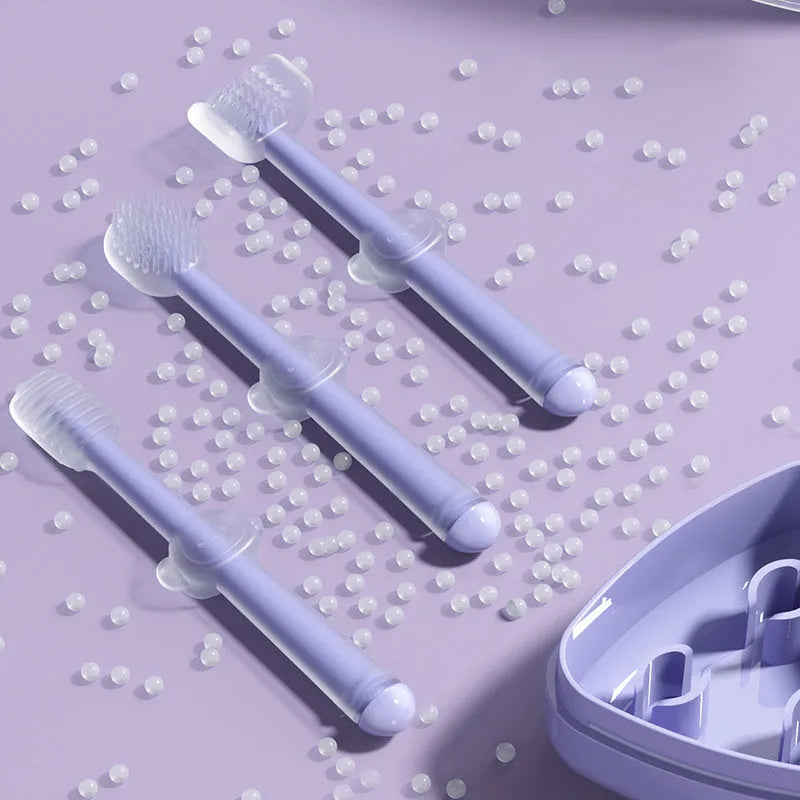 Blue, green, and purple dual-head silicone toothbrushes for pet dental care on a white background.