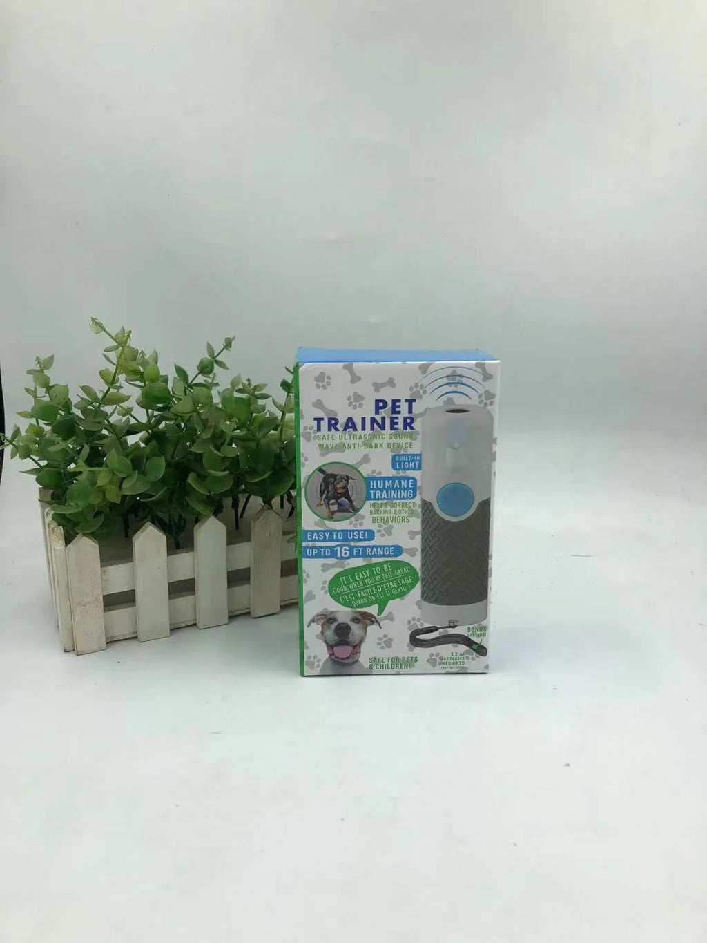 White handheld ultrasonic dog bark trainer with compact design