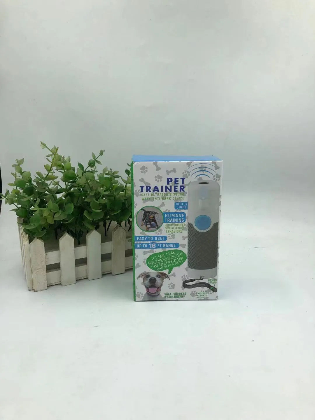 White handheld ultrasonic dog bark trainer with compact design