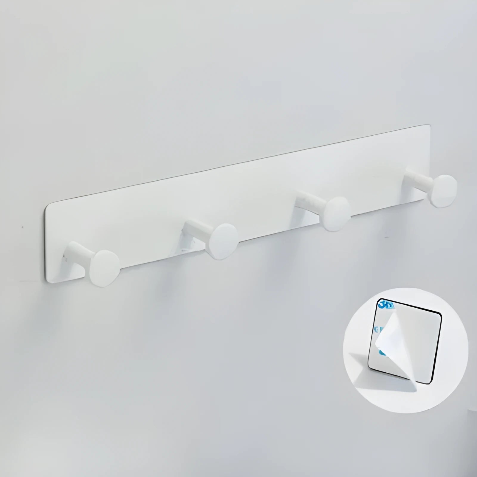 Adhesive mushroom-style wall hook with multiple rows for towels, shown with black double-sided tape.