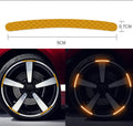 20-piece pack of multicoloured reflective PVC stickers for car and bicycle wheel hubs.