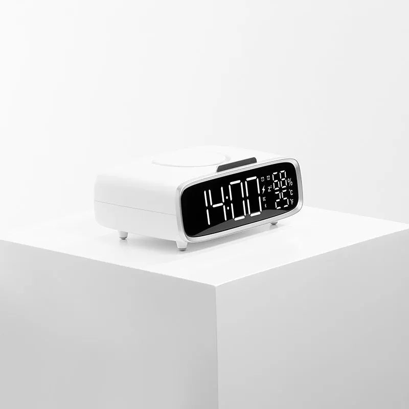 White wireless charger Bluetooth speaker with night light functionality on wooden surface