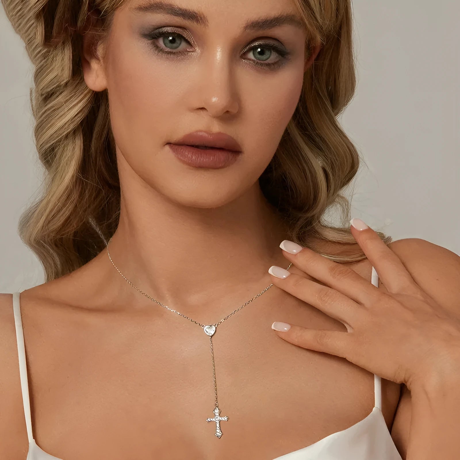 Simple silver love cross pendant on a V-neck O-ring chain, colour BSN384.