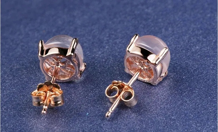 Women's rose gold Korean style drop shaped stud earrings with synthetic ross quartz crystal inlay