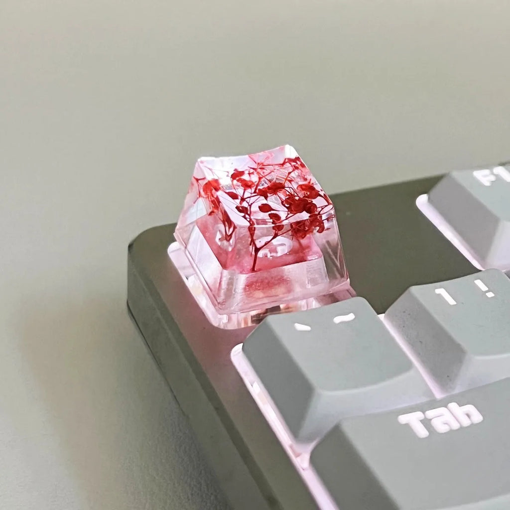 Green resin transparent keycap with glitter starry sky design for mechanical keyboards.