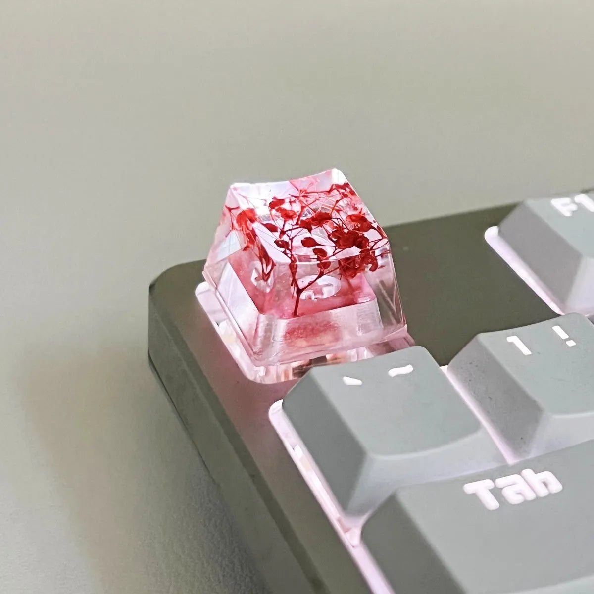 Green resin transparent keycap with glitter starry sky design for mechanical keyboards.