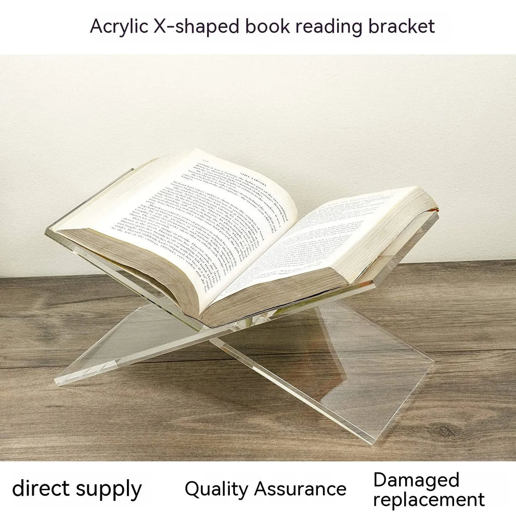 Transparent X-shaped acrylic book reading rack displaying books on desktop