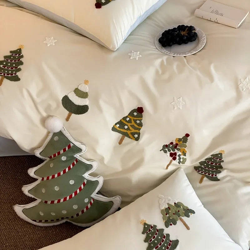 Cream blue embroidered Christmas tree and flowers on a cotton duvet cover with matching pillowcases