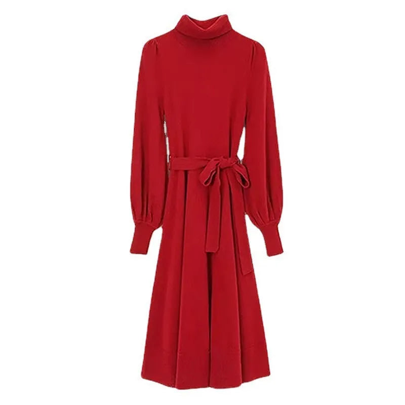 Loose-fit turtleneck knit dress for women with long sleeves, elastic waist, and a flowing mid-length princess skirt.
