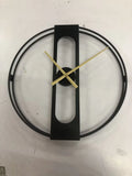 Round metal wall clock in black or gold, 50 cm diameter, on a white wall.
