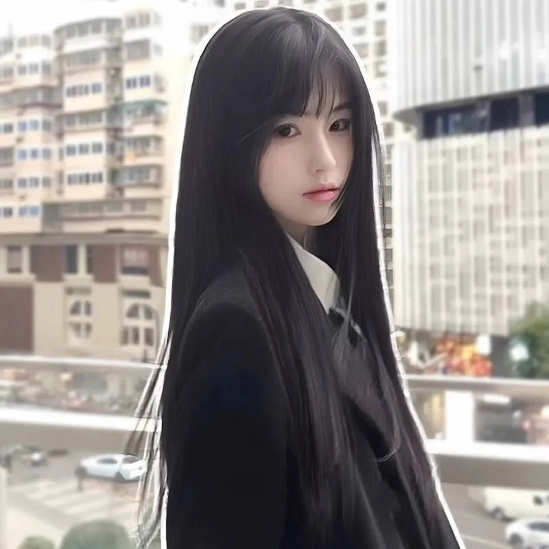 Long straight synthetic wig with bangs in brown-black colour on display