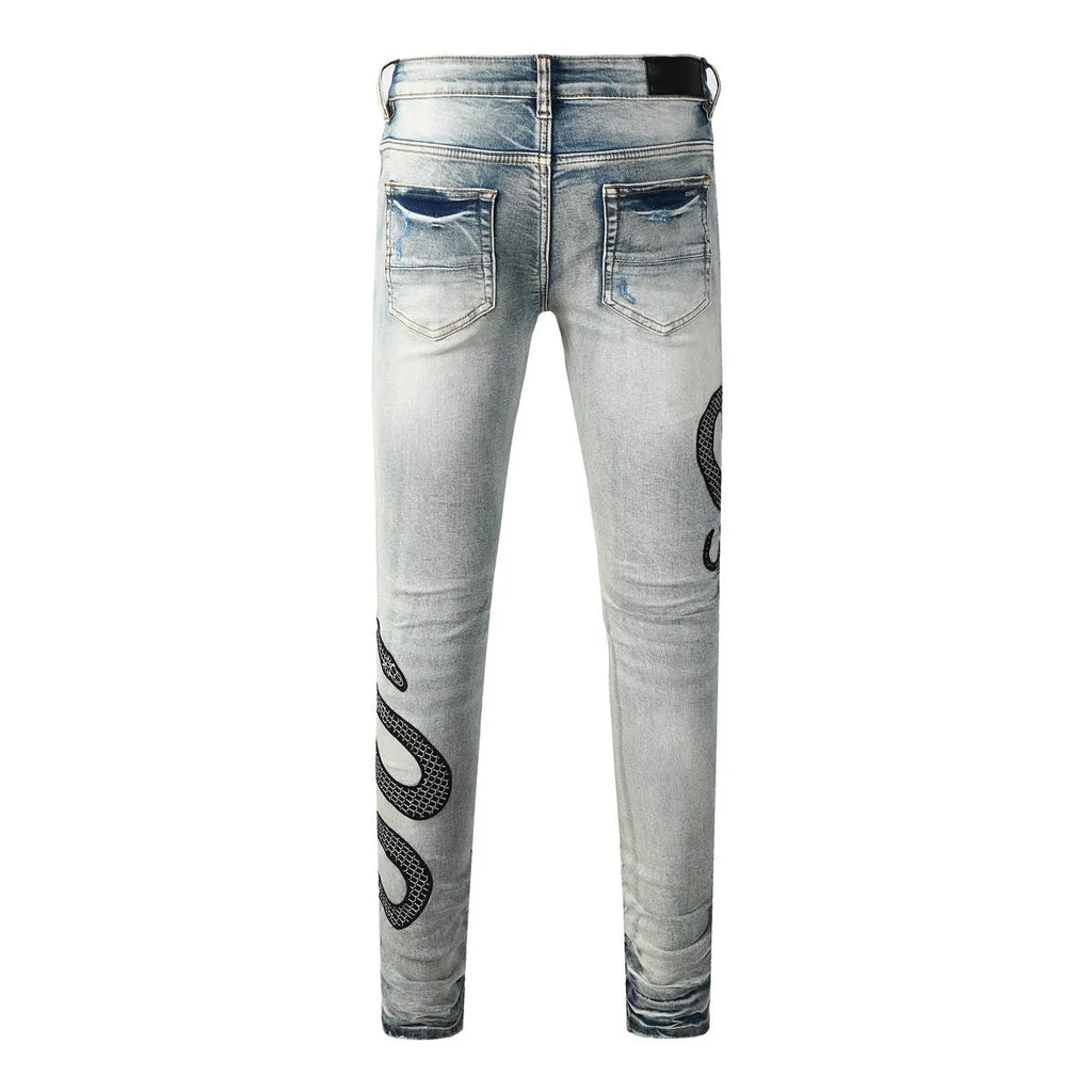 8934Blue distressed skinny jeans with a retro wash and button fly on a mid waist