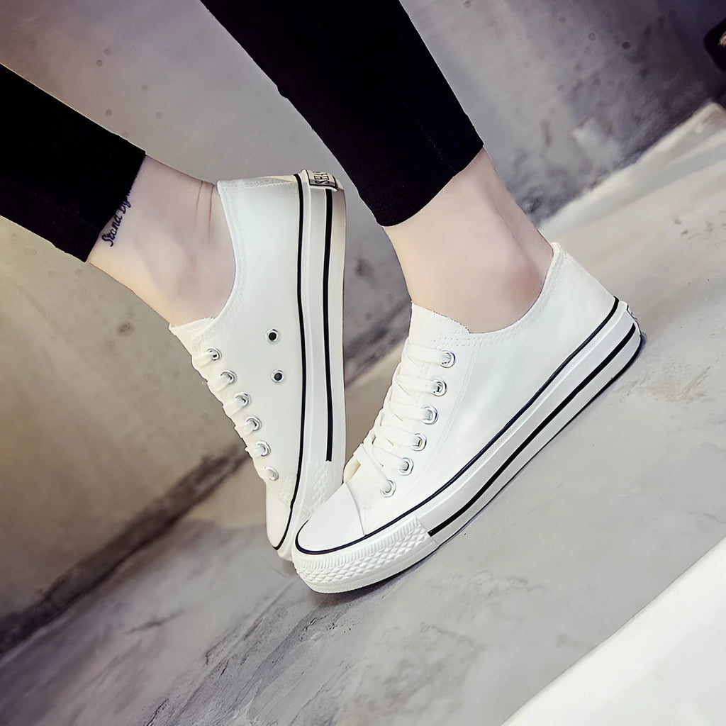 Women's solid colour canvas casual flat shoes showing available colour options and size range