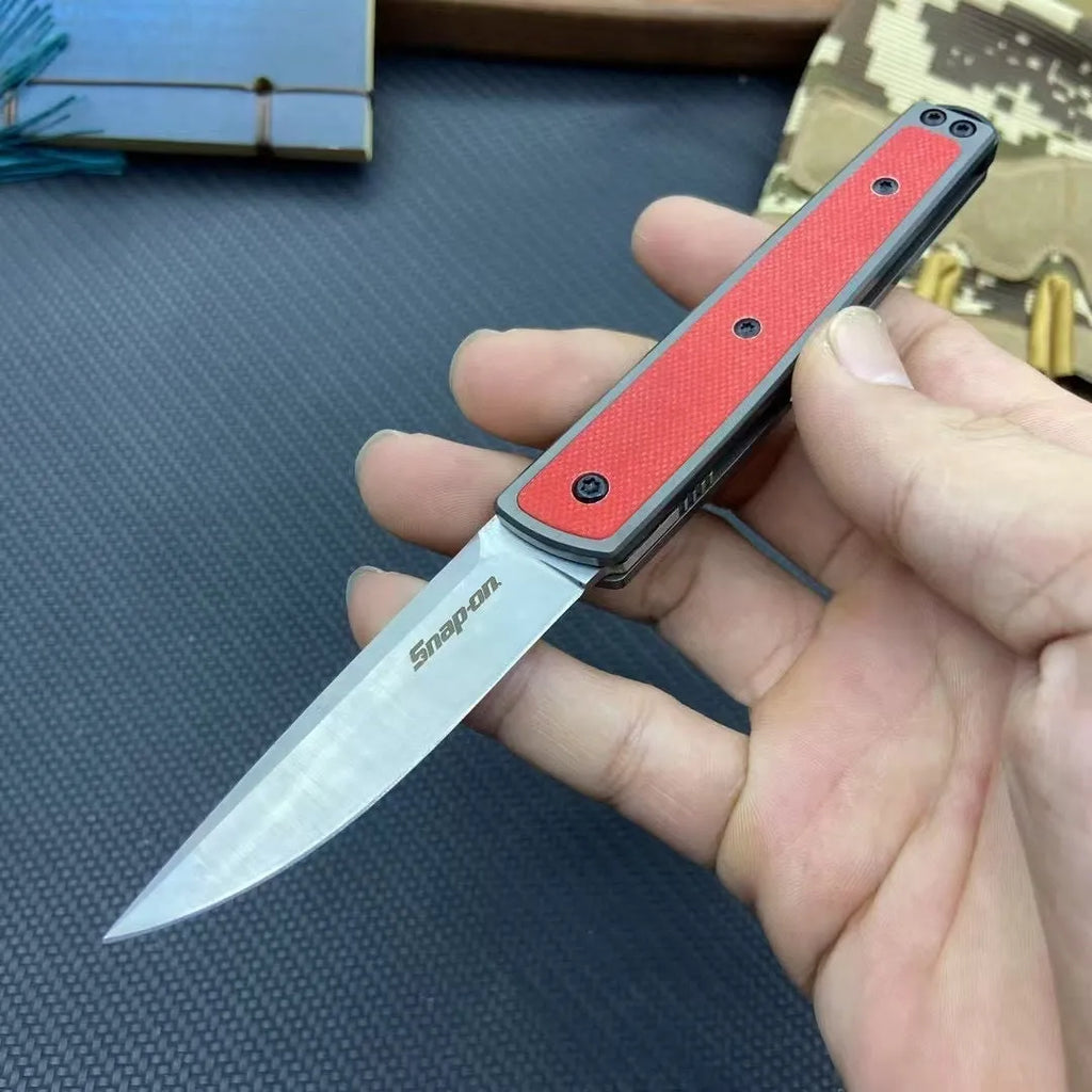 Folding fruit knife with stainless steel blade shown in open position with measurements
