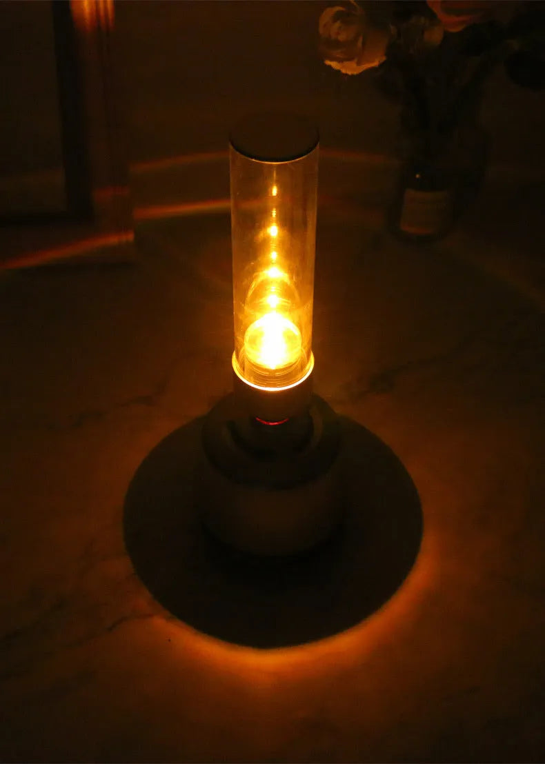 White silver Bluetooth speaker with LED candlelight night light showing modern simple design