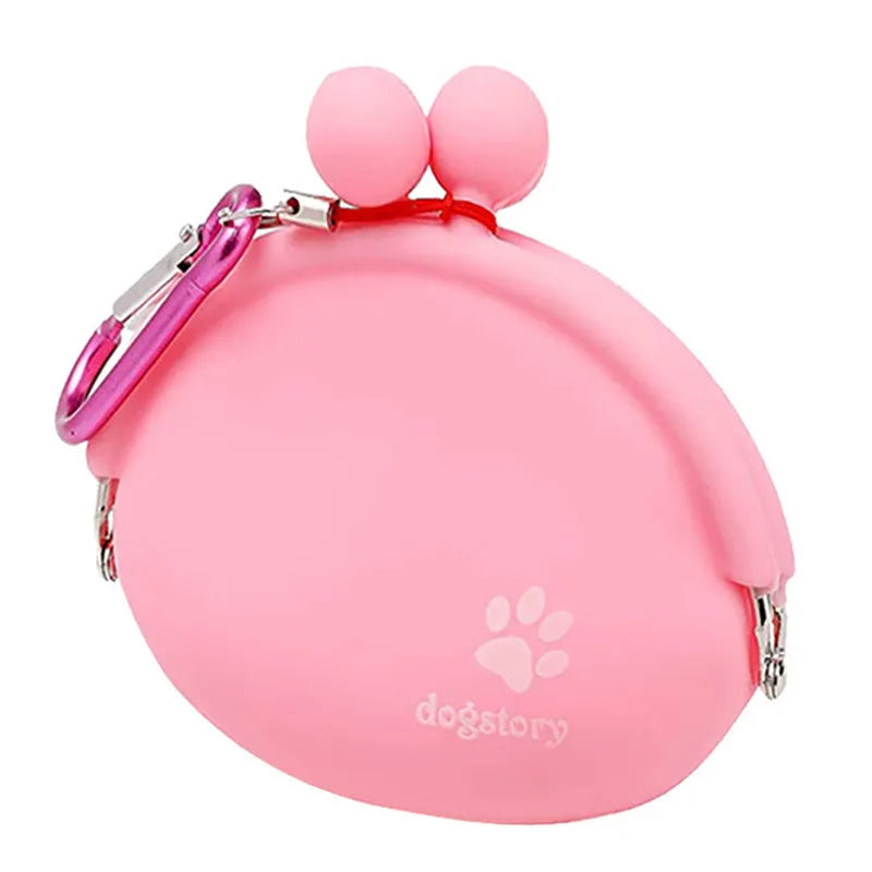 Yellow silicone dog training treat pouch with hook-and-loop waist strap, shown with dog biscuits.