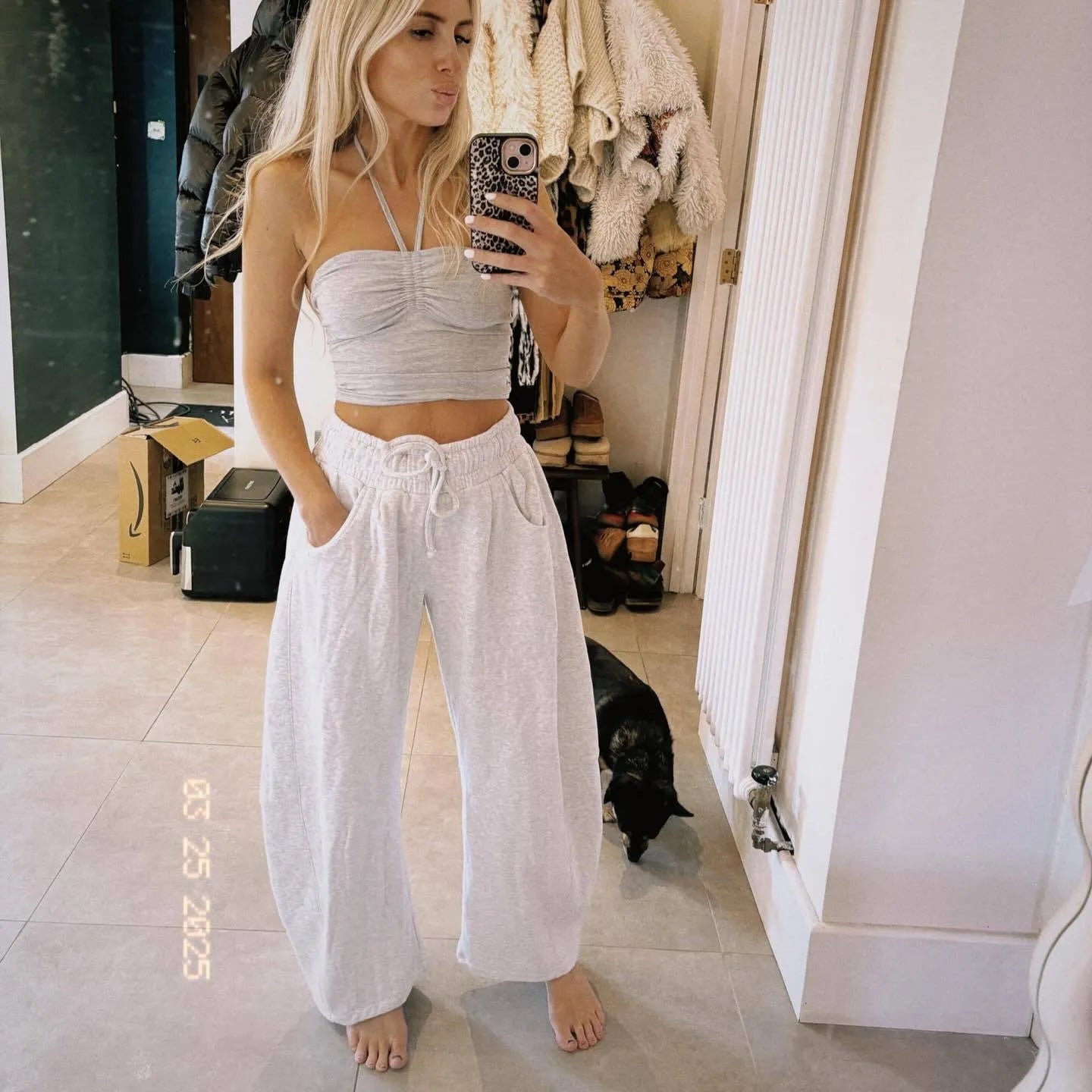 Women's loose cotton cropped sweatpants with drawstring waist in street fashion styling
