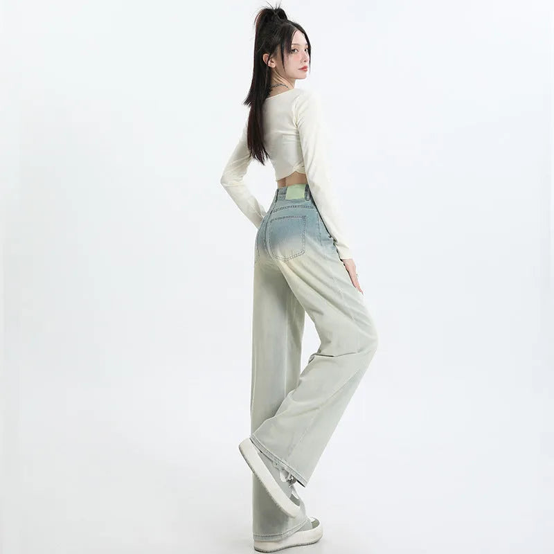 Women's gradient blue straight-leg denim trousers showing wider cut through thigh and calf