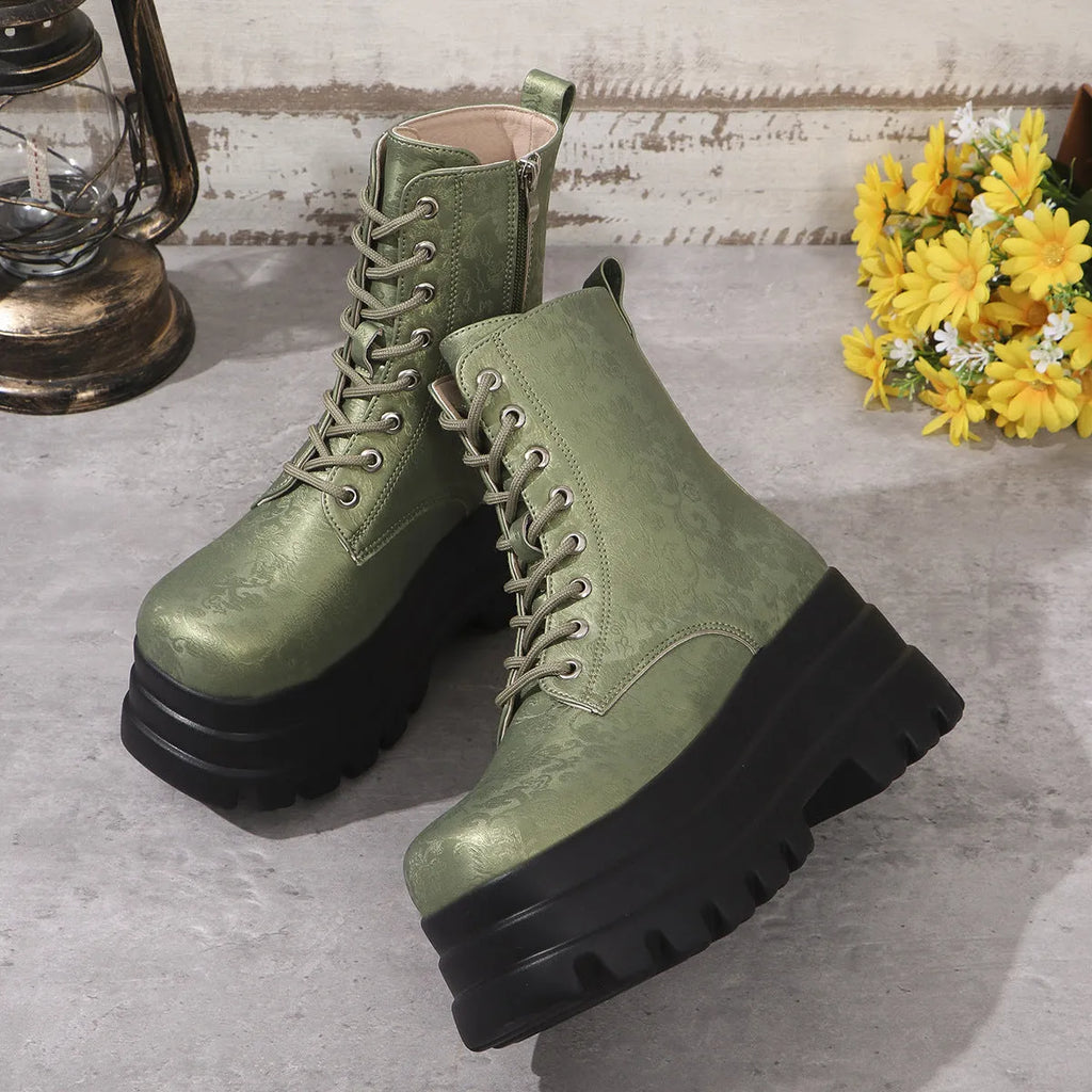 Women's black platform Martin boots with chunky heel and side zipper on a white background.