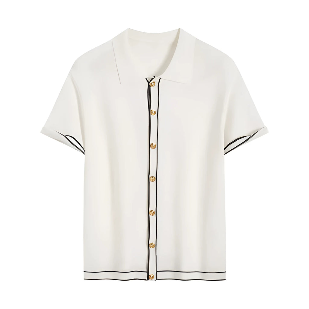 White women's short sleeve cardigan with dark contrast lapels on a hanger.