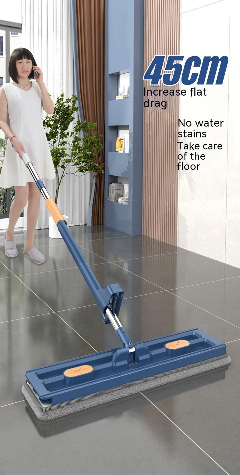 Large flat mop with a long stainless steel handle and a blue microfiber cloth on a hard floor.