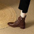 Women's black pointed-toe short tube boots with 5.5cm heel and artificial PU upper