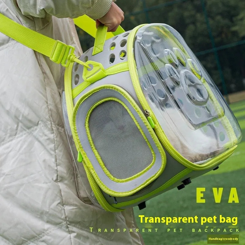 Transparent hard EVA space capsule backpack for cats, shown in green, with large interior and backpack straps.