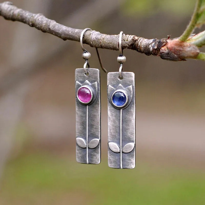 Antique finish red sapphire electroplated metal earrings with geometric ellipse design