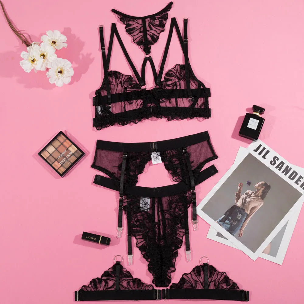Black women's bikini bra with embroidery stitching on mesh fabric, showing three-point style.