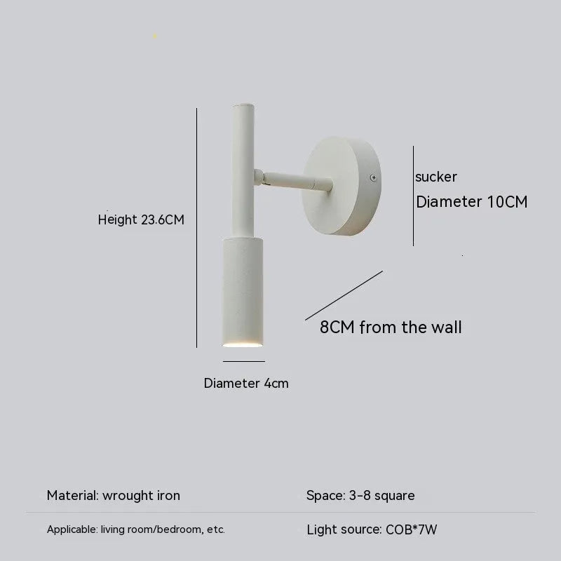 Modern wrought iron wall lamp in black with three colour light options for bedroom or living room
