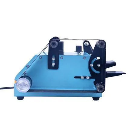 Blue desktop dual-axis belt sander with 750W motor and knife sharpener accessory on workbench