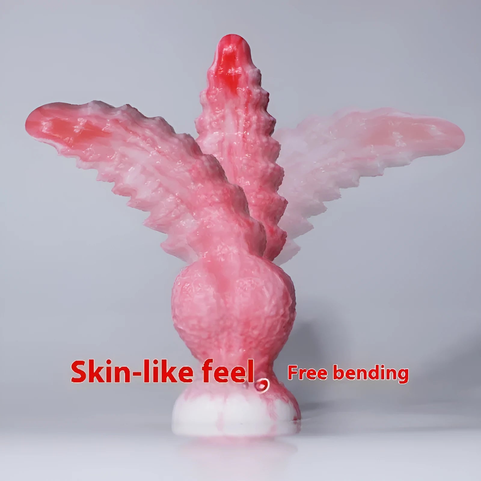 Pink platinum silicone penis-shaped masturbation toy on a neutral background