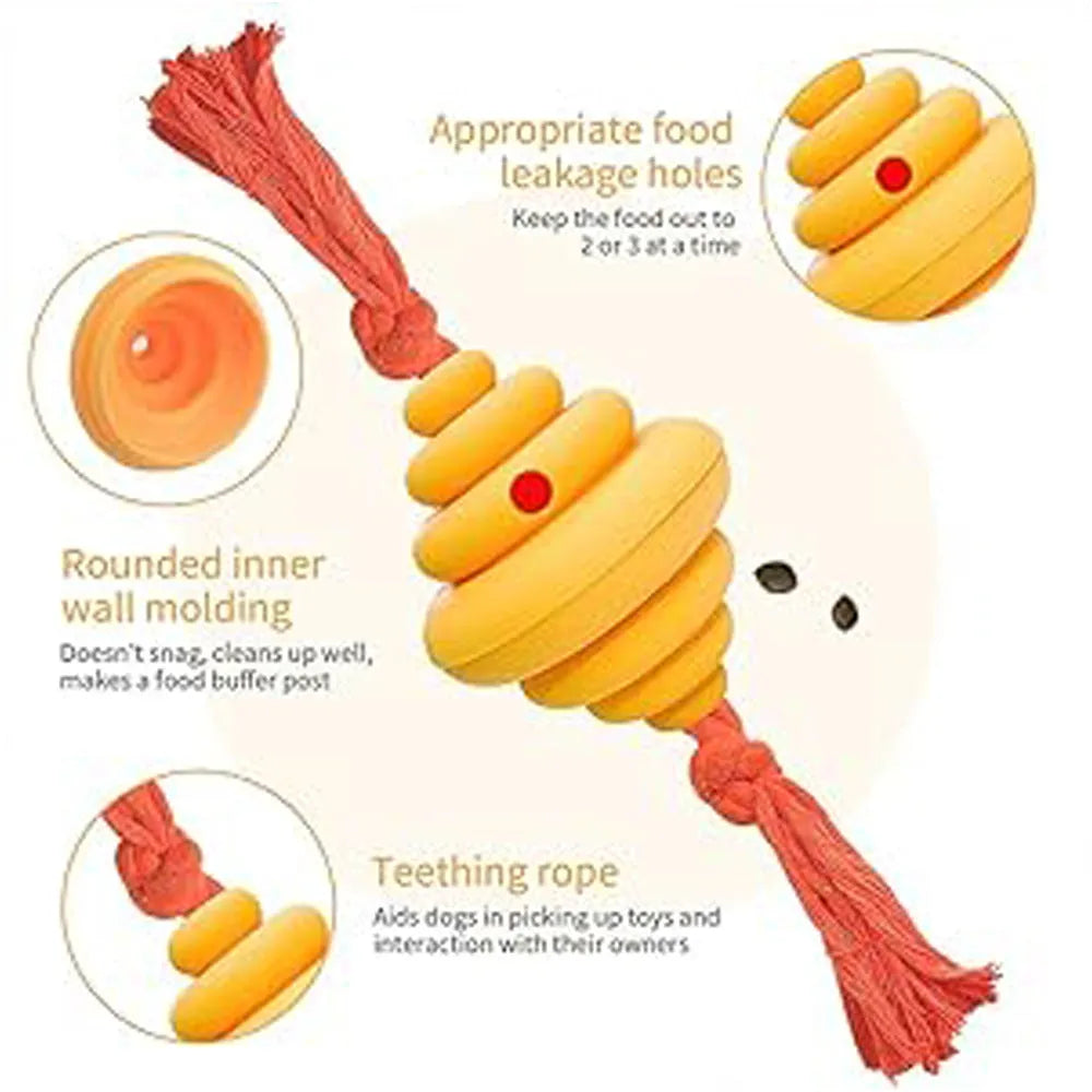 Green and yellow silicone dog ball with attached rope for tug-of-war and treat dispensing.