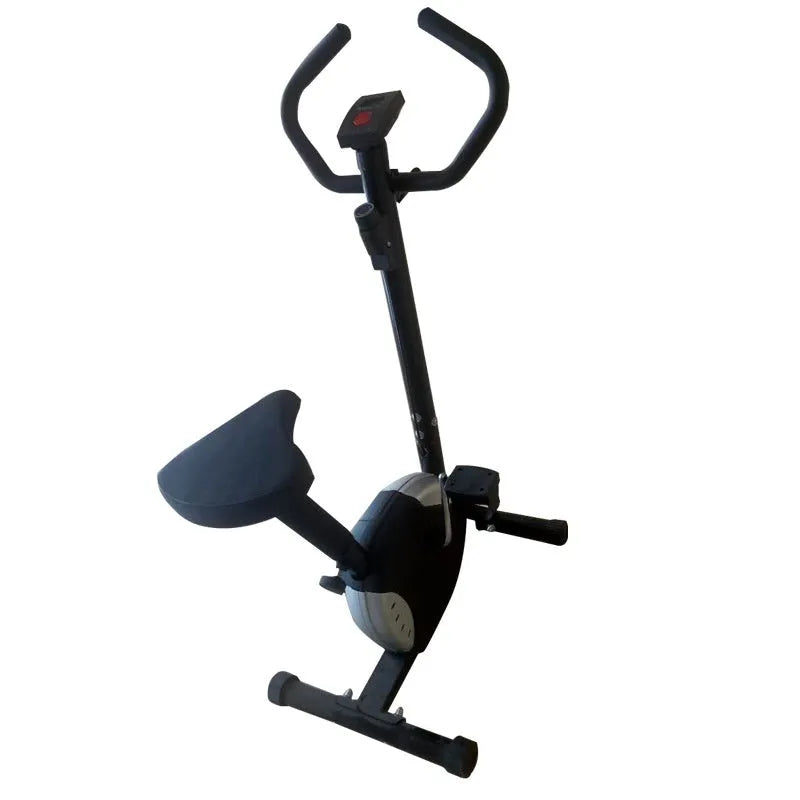Grey spinning fitness bicycle with steel frame and foam handlebars for home office cardio training