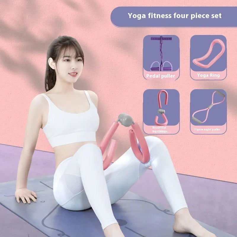 Yoga four-piece fitness set showing leg stretcher, ring, pedal device, and tension rope on a floor.