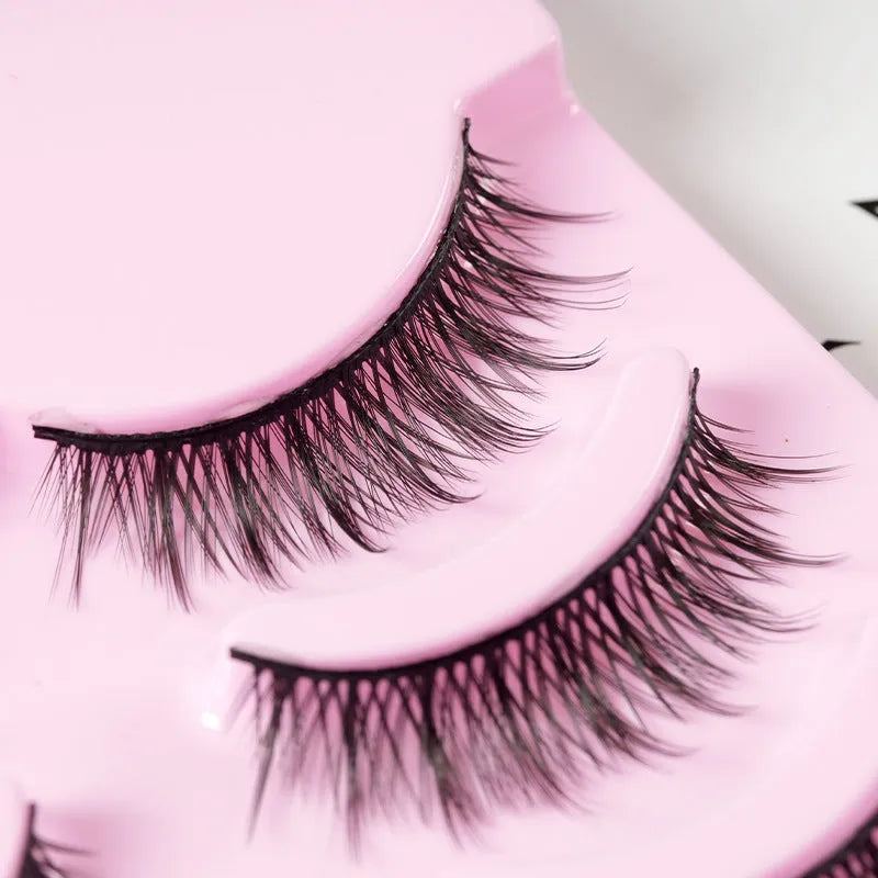 Set of manga anime style false eyelashes showing three styles 007, 008, 009 on a plastic black terrier band.