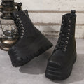 Women's black platform Martin boots with chunky heel and side zipper on a white background.
