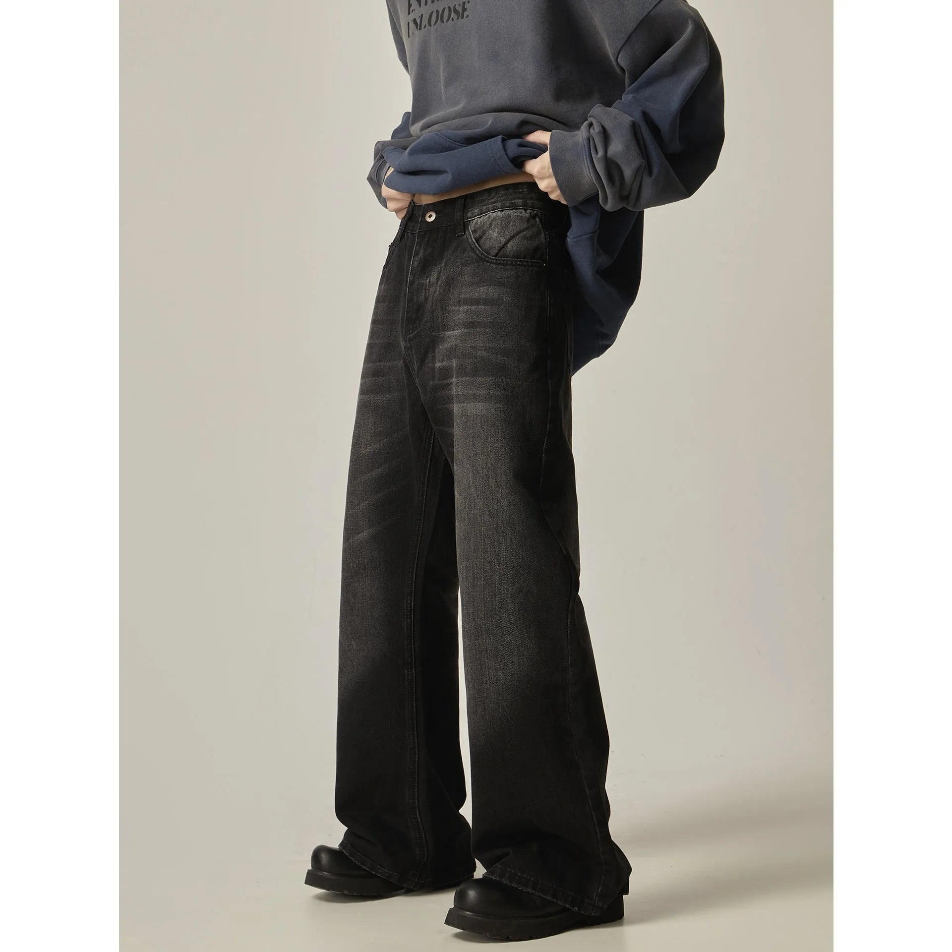 Black loose straight-leg retro jeans with zipper fly on mannequin