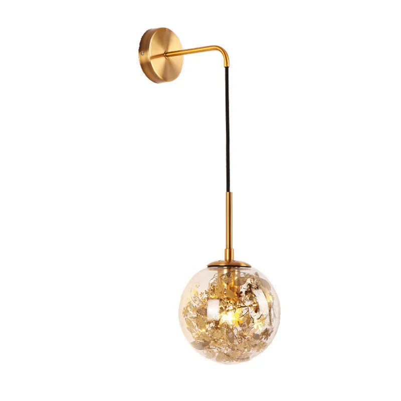 Modern glass wall lamp with golden flower pattern, 20cm size, emitting warm LED light.