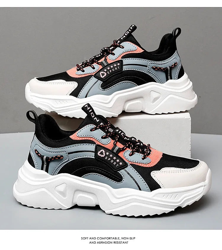 Women's white mesh casual sports shoes with a thick sole and a front buckle strap.
