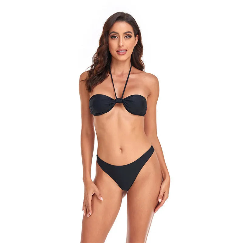 Black women's bikini set with lace-up tube top and matching briefs on white background
