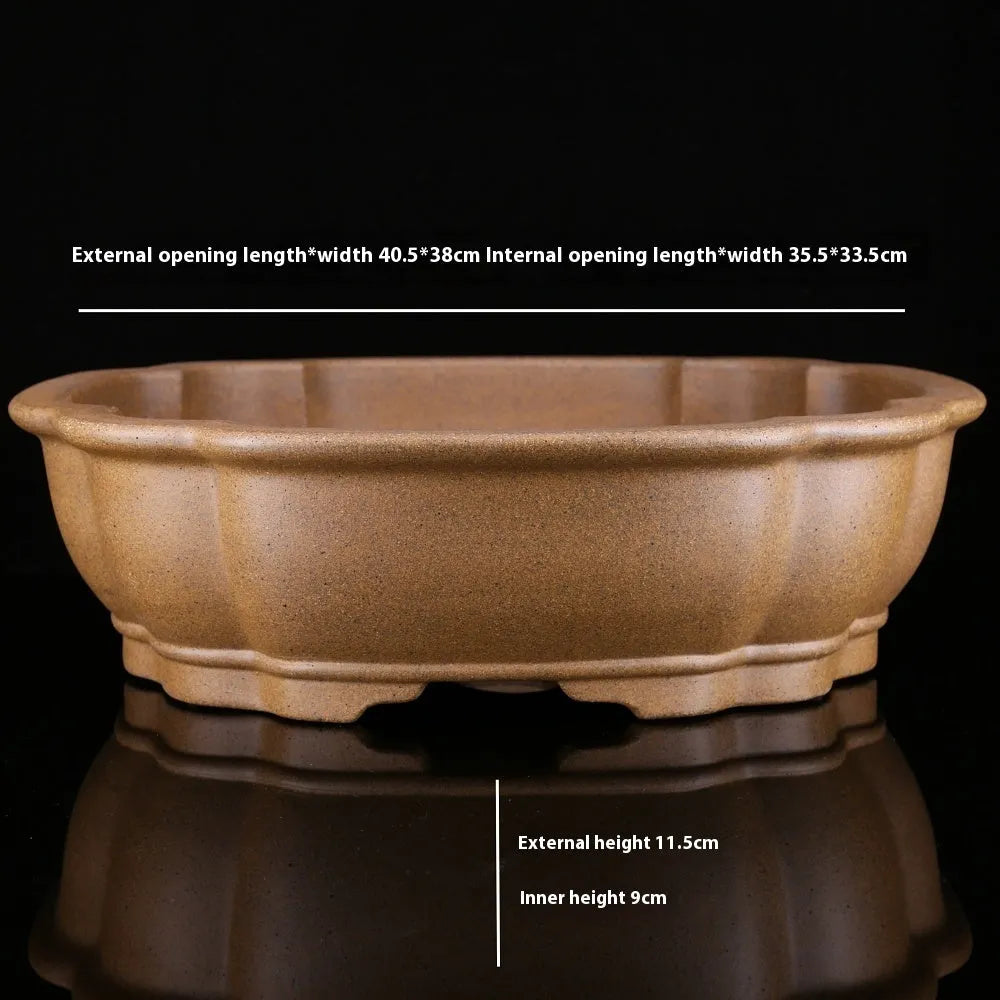 Handmade purple sand bonsai pot with hexagonal shape and Taiwan pine decorative motif