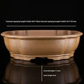 Handmade purple sand bonsai pot with hexagonal shape and Taiwan pine decorative motif