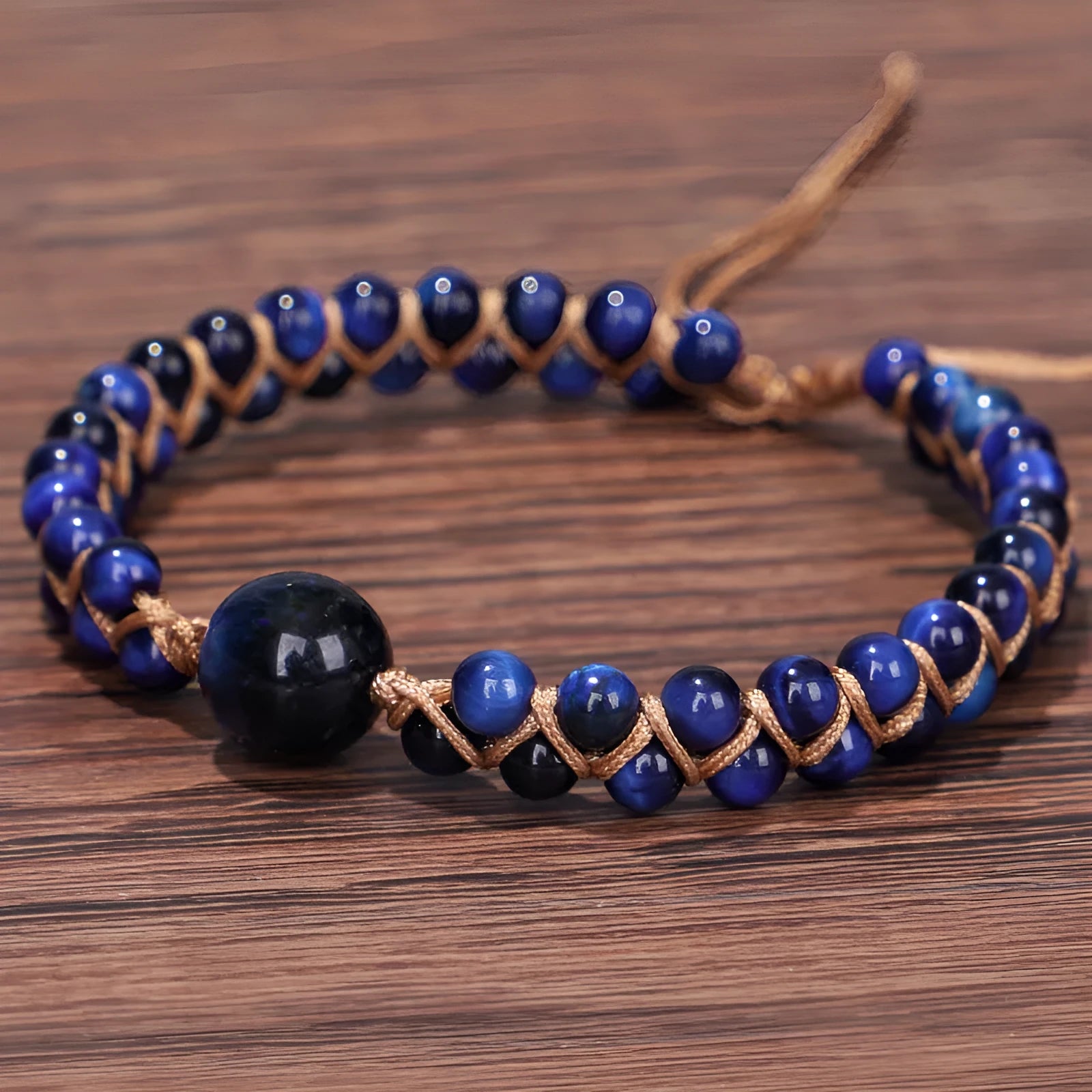 Handmade geometric woven pull bracelet in blue Tigereye stone with visible banding patterns